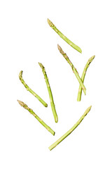Fresh green asparagus spears scattered on a grey surface isolated on transparent background