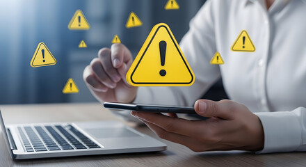 Person holding smartphone with large yellow warning sign, surrounded by alert icons, symbolizing urgent notification check.