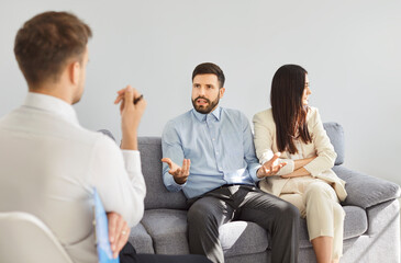 Psychologist conducts a therapy session with a family couple experiencing conflict, divorce and...