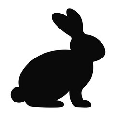 A simple black silhouette of a bunny rabbit isolated on a white background in a studio shot