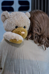 Photo Of A Girl Hugging A Teddy Bear