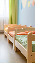 Bright, colorful beds in a children's daycare or school nap room. Quiet and cozy space for little ones to rest.