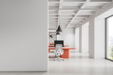 Modern office interior with blank white wall and coral desks for poster or design mockup...
