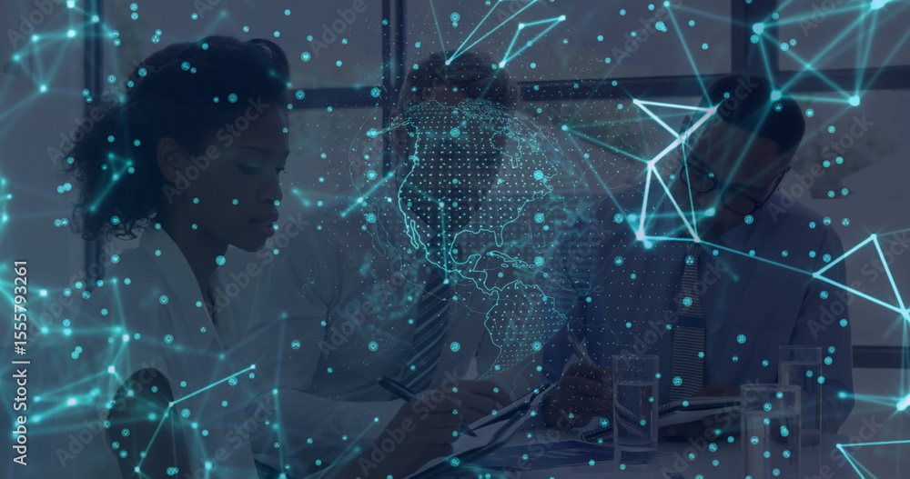 Poster collaborating team in suits reviewing documents on boardroom table with holographic network overlay