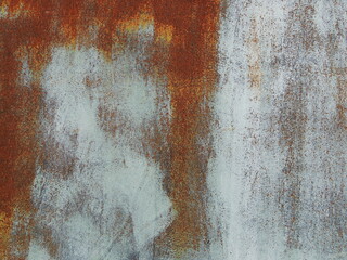 rusting metal texture with white paint strokes as abstract empty rough background, textured rusting iron sheet with place for insertion, oxidized metal graphic resource