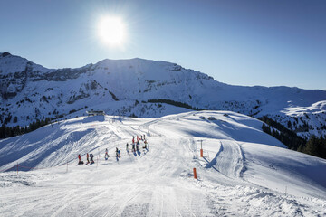 Ski slopes with young skiers preparing for a competition, Megeve, France