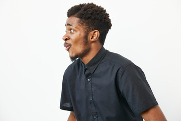 A surprised black man expressing excitement, showcasing emotions with vibrant energy. This image...