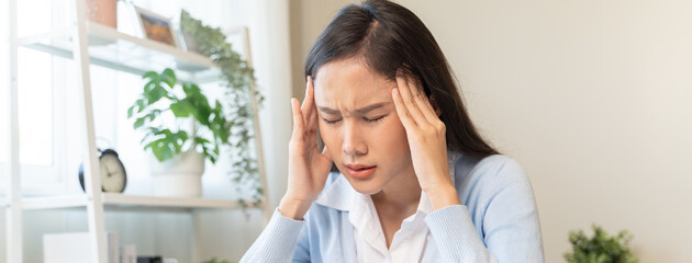 woman taking off glasses tired of computer work suffering from eye strain tension