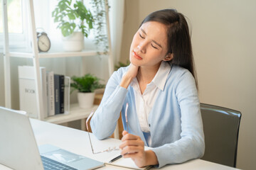 Office workers have neck pain from bad posture during sitting and work.