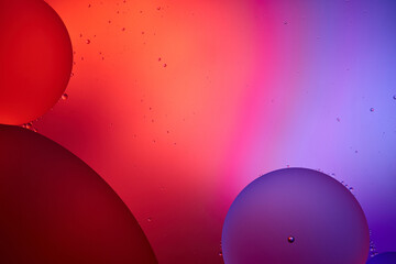Beautiful color abstract background from mixed water and oil bubbles in pink
