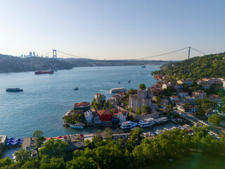 Fatih Sultan Mehmet Bridge Panoramic view of Istanbul Bosphorus coastline with a bridge. High-angle, full shot of the Istanbul coastline, showcasing a beautiful waterfront cityscape buildings, boats