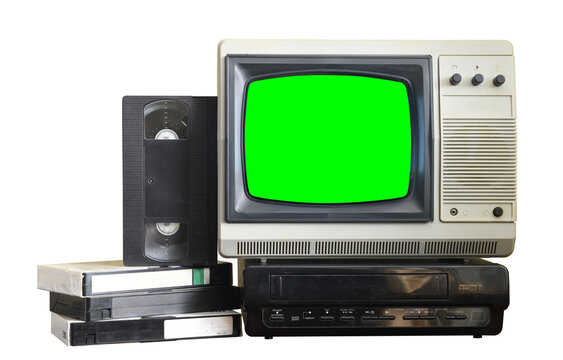 Old black vintage television with green screen and VCR from 1980s, 1990s, 2000s isolated on green background.