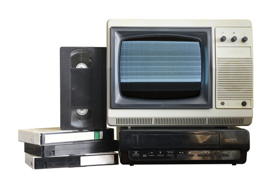Old vintage TV with static on screen and VCR and video cassettes isolated on white background.