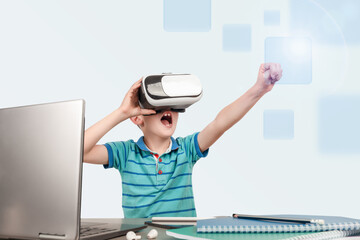 An excited young boy explores a virtual world with VR goggles, sitting at a desk with a laptop and school supplies, imagining adventures in a futuristic digital learning environment