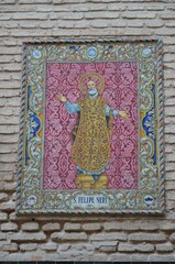 Mosaic - ceramic panels from colored tiles on the walls of houses