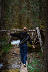 Woman balancing on log