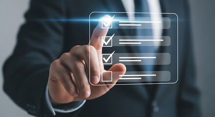 Businessman checking off tasks on digital list image