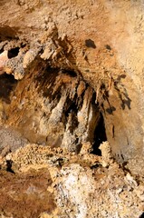 Inside of beautiful old dark cave with many stalactites. Grotte di Is Zuddas, Italy, Sardinia