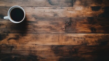 Minimalist home office with a cup of coffee, flowers on a wooden desk. Sunny morning. Space fot text