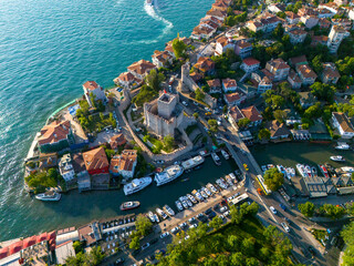 Anatolian Fortress Stunning Aerial View of a Coastal Town with Marina. High-angle, panoramic view of a picturesque coastal town nestled along a waterway. Anadolu Hisari Beykoz Kucuksu Turkey Istanbul