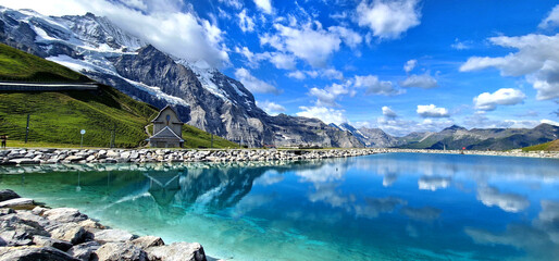 Switzerland nature . panoramic view of Fallboden lake with turquoise water and reflections of snowy...