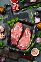 Raw meat. Fresh pork steak. Meat on a plastic black container from the market. Close-up.
