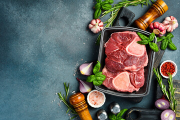 Raw meat. Fresh ossobuko beef steak. Meat on a plastic black container from the market. Close-up.