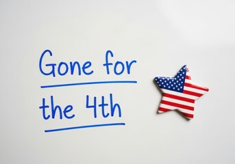 Gone for the 4th of July Text on an Office Whiteboard a US Independence Day Business Notice with Copy Space