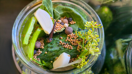 Jars with cucumbers and spices for preservation. Fermentation of cucumbers,