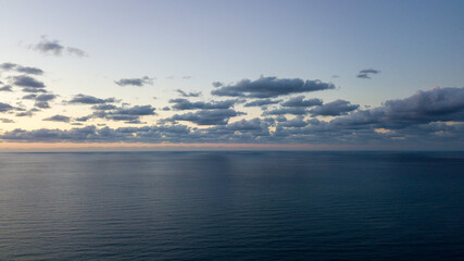 Aerial view, drone flight over sea in a beautiful sunset on the beach in Sicily, Italy