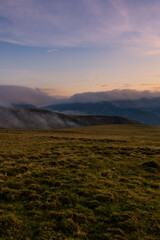 Sunset in the Carpathian Mountains is a magical moment — golden light bathes the peaks, clouds...