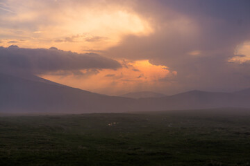 Sunset in the Carpathian Mountains is a magical moment — golden light bathes the peaks, clouds...
