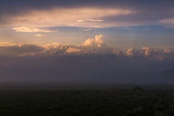 Sunset in the Carpathian Mountains is a magical moment — golden light bathes the peaks, clouds...