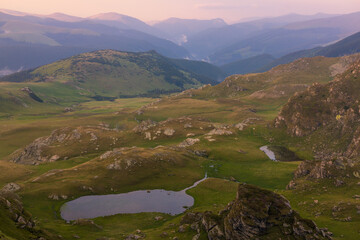 Obraz premium The Carpathian Mountains in Romania are a majestic mountain range, rich in wildlife, forests, and breathtaking landscapes.