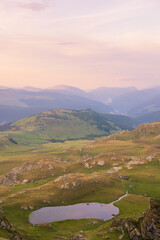 Sunset in the Carpathian Mountains is a magical moment — golden light bathes the peaks, clouds...