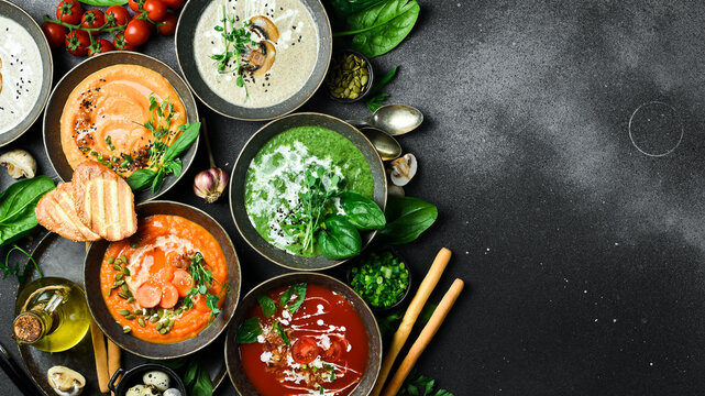 A set of dietary colored vegetable soups. In a bowl. The concept of vegetarian food. Top view. - Powered by Adobe