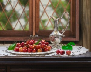 Still life with cherry and silver jug