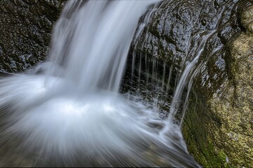 Fototapeta premium Serene Waterfall Cascade Close-Up Nature Photography