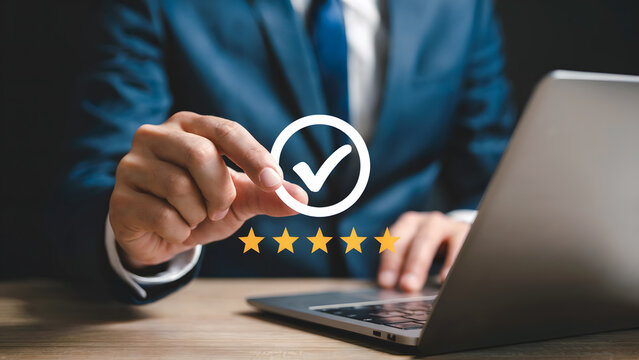 Business person showcasing five star rating near laptop depicting positive online review and satisfaction for excellent service and quality assurance in business.