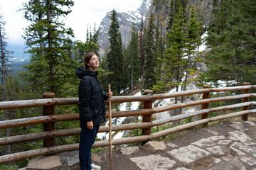 Female hiker pauses peacefully at viewpoint