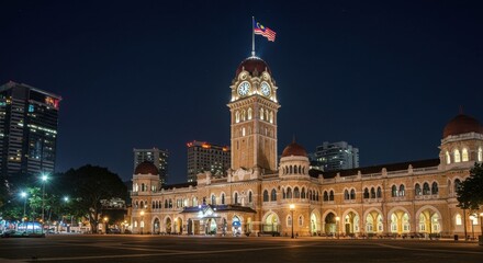Naklejka premium Majestic Kuala Lumpur Railway Station at Night: A Breathtaking View of Malaysian Architecture