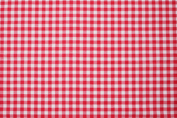 Closeup of a red and white checkered napkin or tablecloth texture. picnic cloth crumpled. Food...
