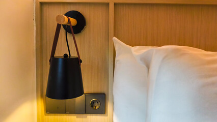 contemporary bedroom interior with Modern Upholstered Headboard, white bed featuring a cozy blanket