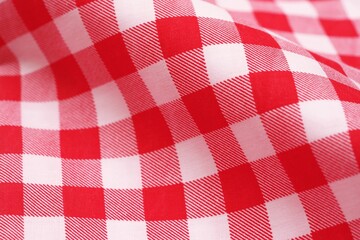 Closeup of a red and white checkered napkin or tablecloth texture. picnic cloth crumpled. Food...