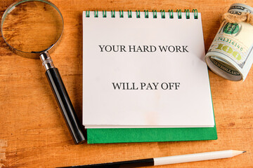 Concept of building success foundation. Text YOUR HARD WORK WILL PAY OFF