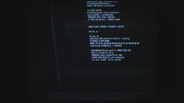Programming language or information getting displayed on computer against a dark background.