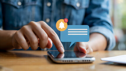 Exploring mobile notifications on smartphone, a user engages with the bell icon and message bubble for enhanced digital communication, technology and connection.