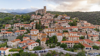 Fototapeta premium Aerial view of Eus, the medieval hilltop town in Pyrenees mountains, France.