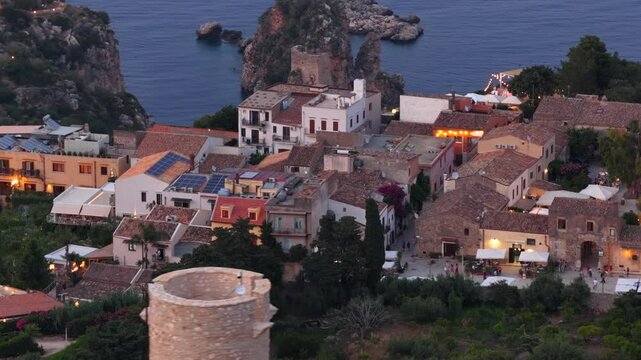 La torre Bennistra che domina Scopello e la Tonnara. Trapani, Sicilia, Italia. 
Vista aerea panoramica della baia di Scopello, tra Palermo e San Vito Lo Capo. Riserva dello Zingaro. 