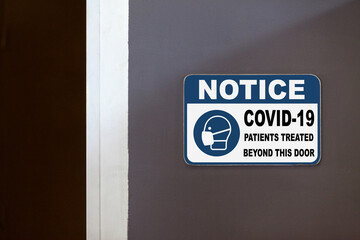 Notice, COVID-19 patients treated beyond this door